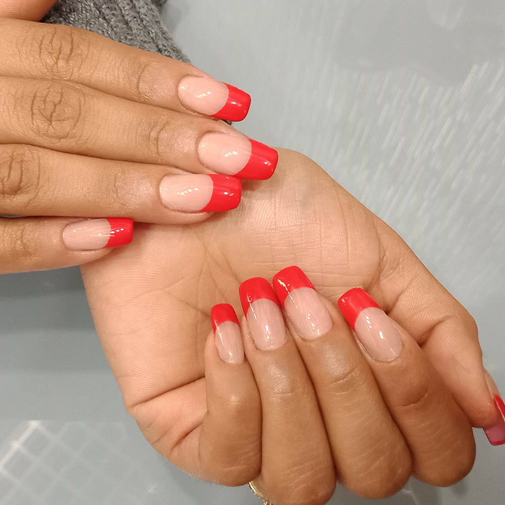 Acrylic Nail Extensions With A Red French Gel Polish